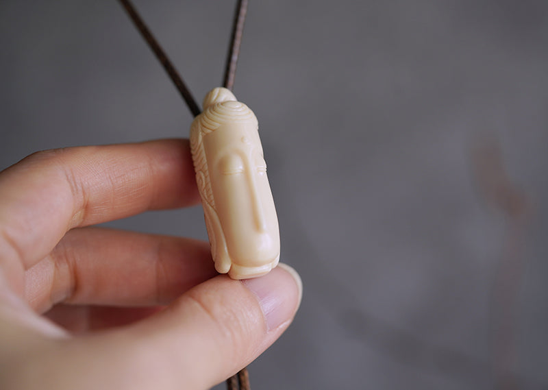 Hand-Carved Mammoth Ivory Bolo Tie - The Zen Awakening: Minimalist Buddha