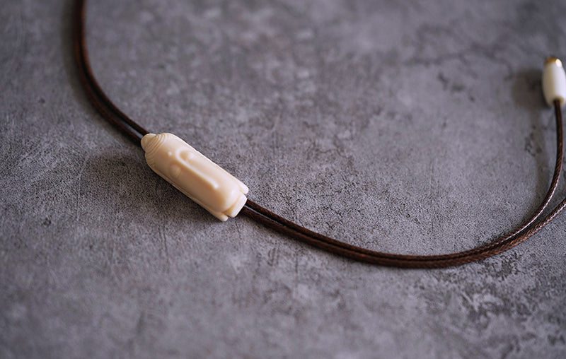 Hand-Carved Mammoth Ivory Bolo Tie - The Zen Awakening: Minimalist Buddha