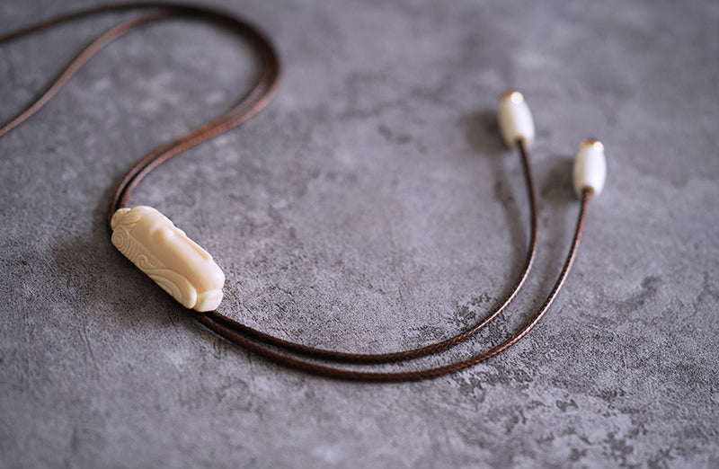 Hand-Carved Mammoth Ivory Bolo Tie - The Zen Awakening: Minimalist Buddha