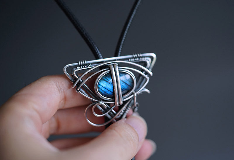 The Eye of Horus: Hand-Woven Sterling Silver Labradorite Bolo Tie