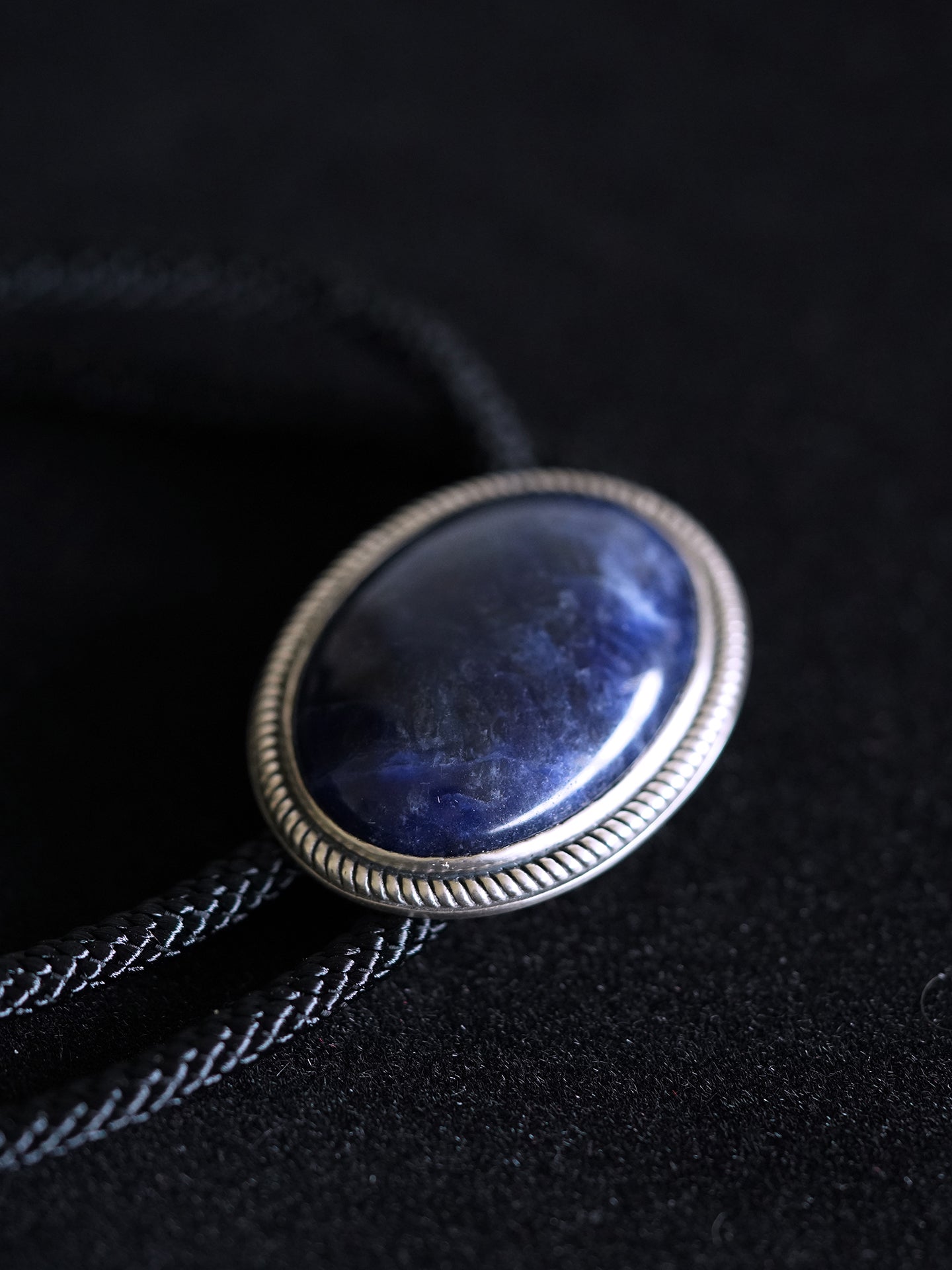 The Abyssal Tide · Sodalite Bolo Tie in Sterling Silver