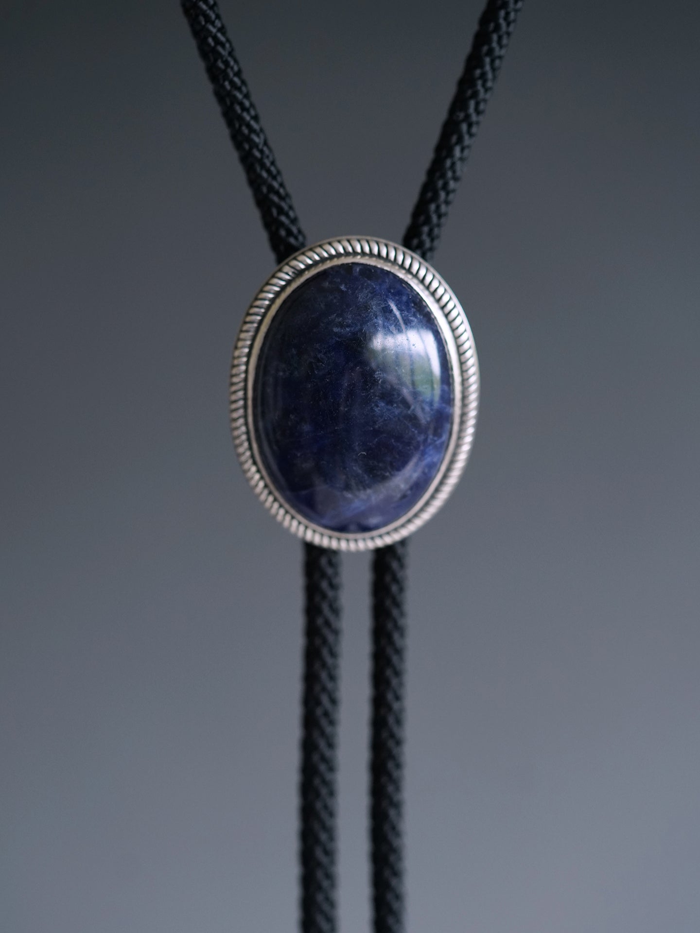 The Abyssal Tide · Sodalite Bolo Tie in Sterling Silver