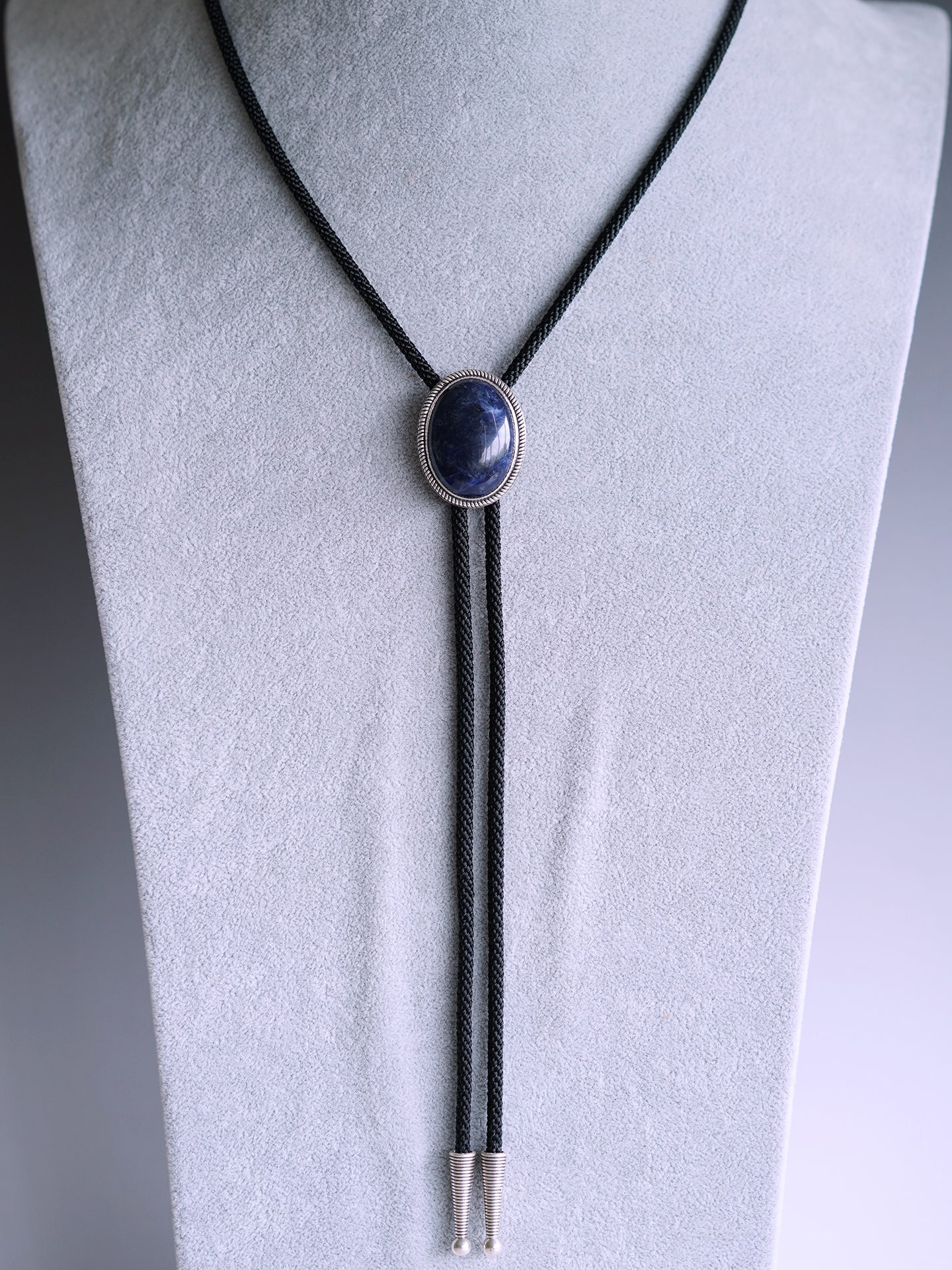 The Abyssal Tide · Sodalite Bolo Tie in Sterling Silver