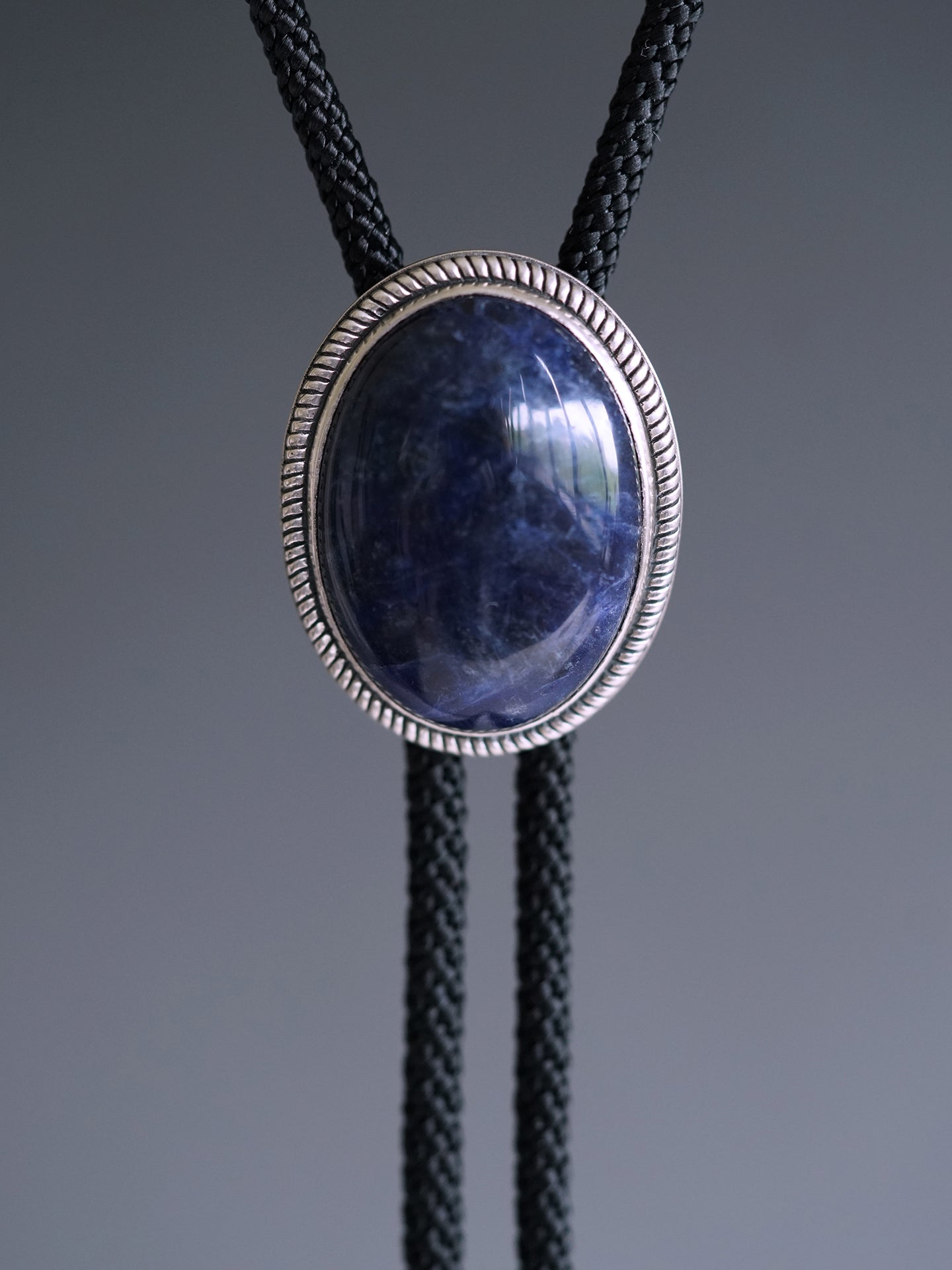 The Abyssal Tide · Sodalite Bolo Tie in Sterling Silver