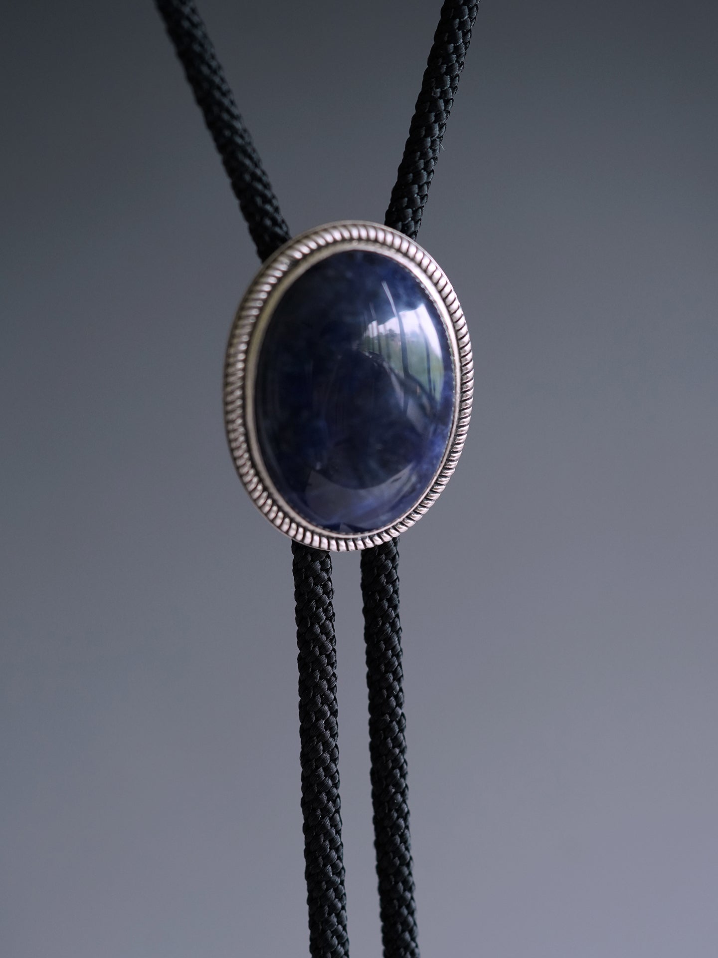 The Abyssal Tide · Sodalite Bolo Tie in Sterling Silver
