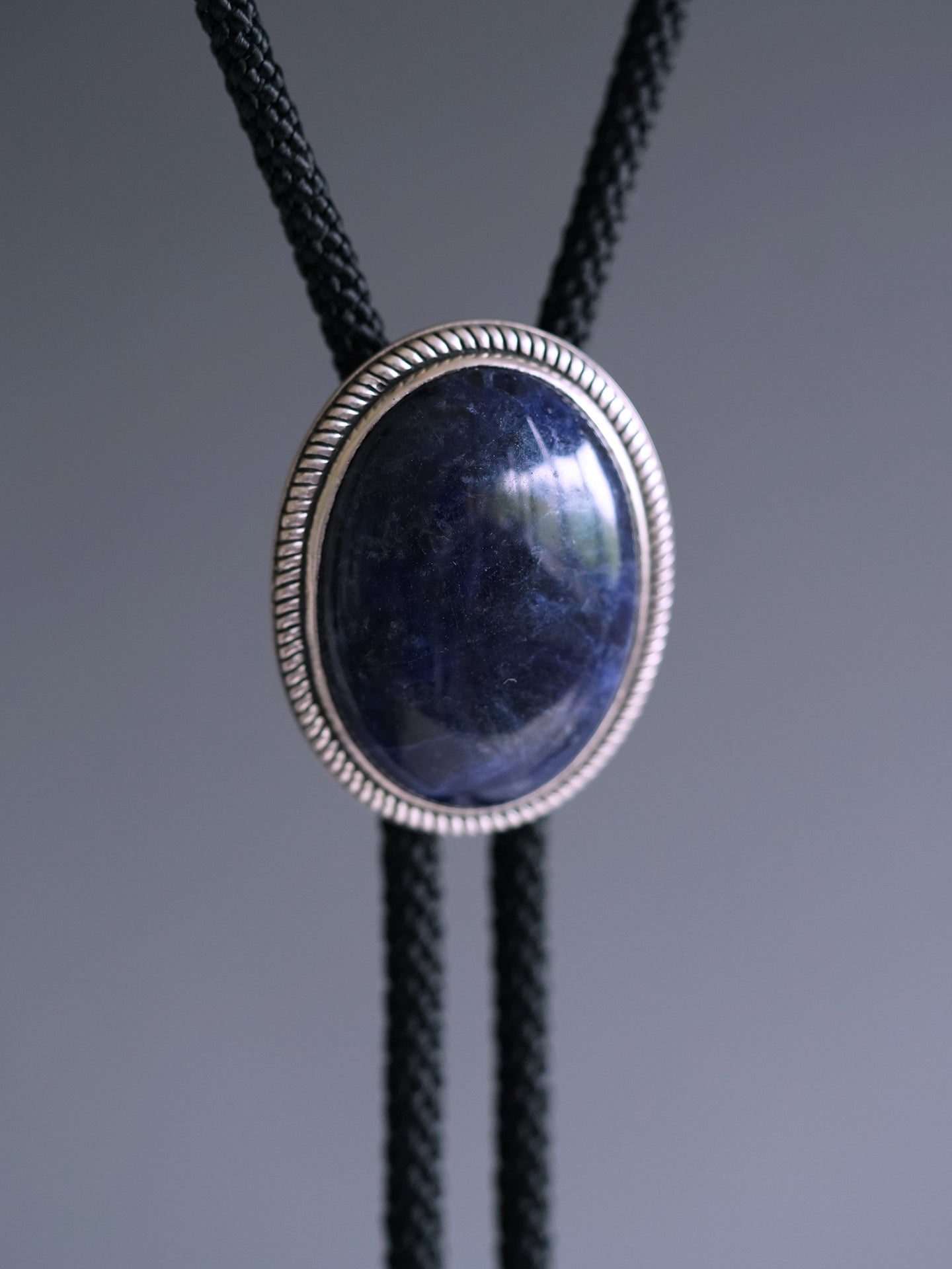 The Abyssal Tide · Sodalite Bolo Tie in Sterling Silver