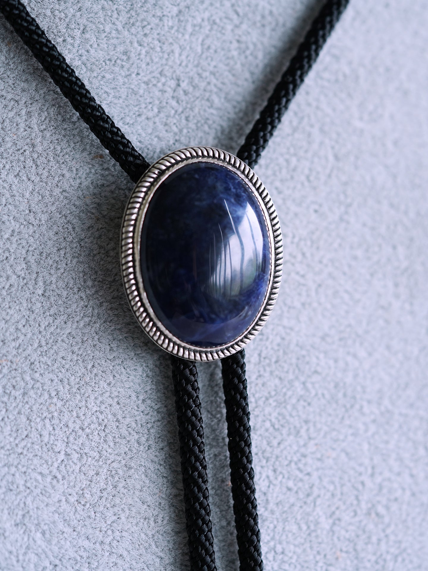 The Abyssal Tide · Sodalite Bolo Tie in Sterling Silver