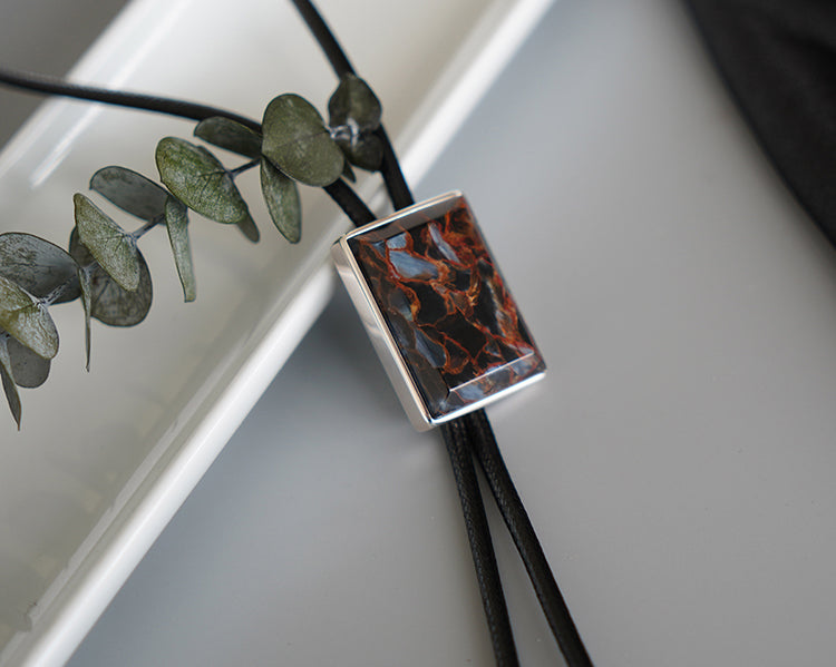 The Contained Tempest: Premium Rectangular Pietersite Solid Silver Bolo Tie