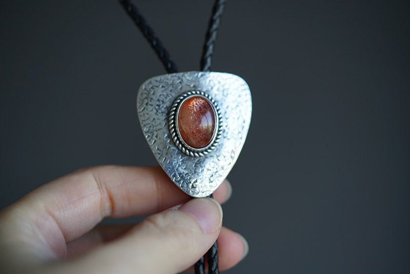 Shield of Light: Sunstone & Hammered Silver Bolo Tie
