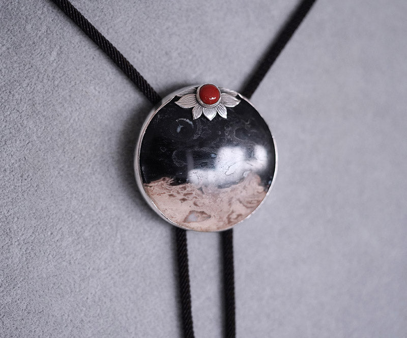 “The Solitary Sun” Handcrafted Silver & Palm Root Fossils Bolo Tie