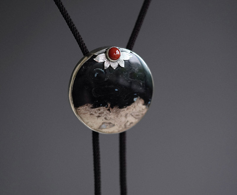 “The Solitary Sun” Handcrafted Silver & Palm Root Fossils Bolo Tie