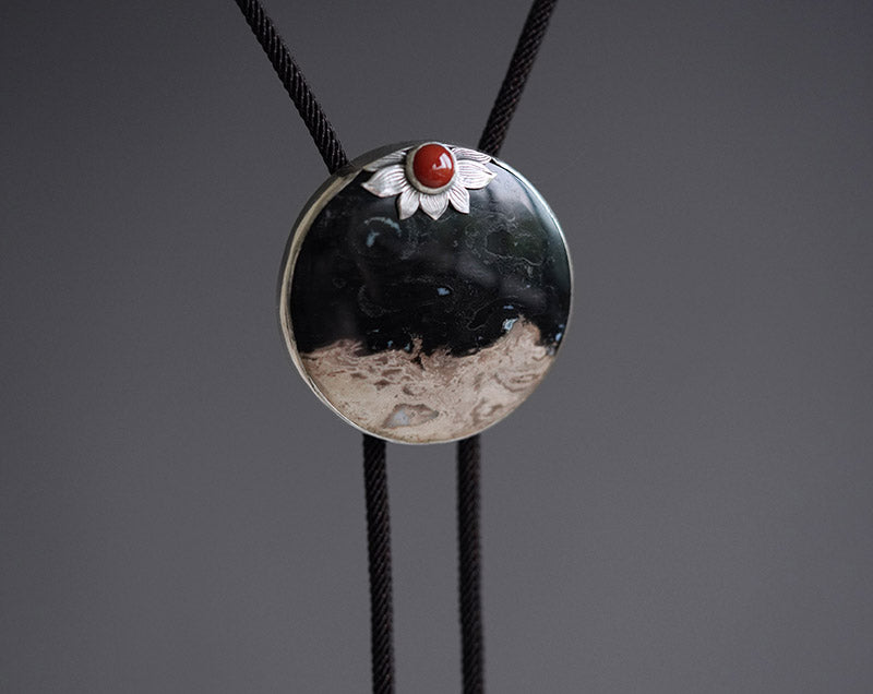 “The Solitary Sun” Handcrafted Silver & Palm Root Fossils Bolo Tie