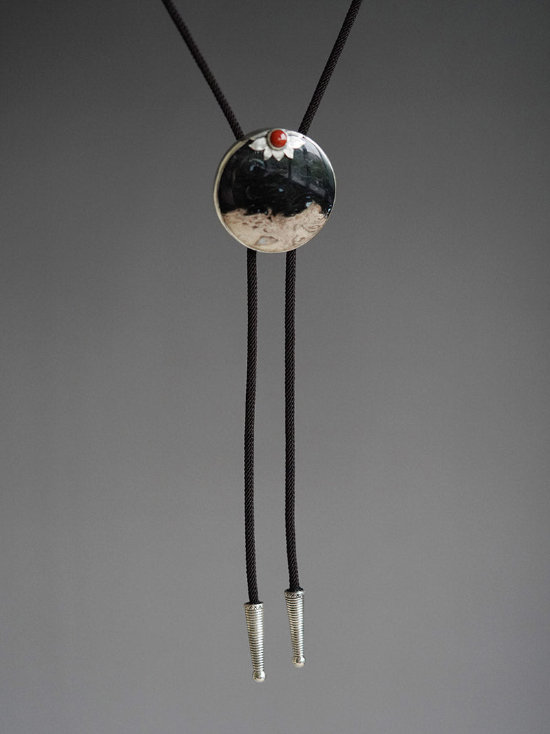 “The Solitary Sun” Handcrafted Silver & Palm Root Fossils Bolo Tie