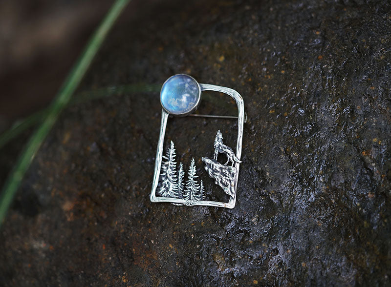 silver brooch with moonstone wolf