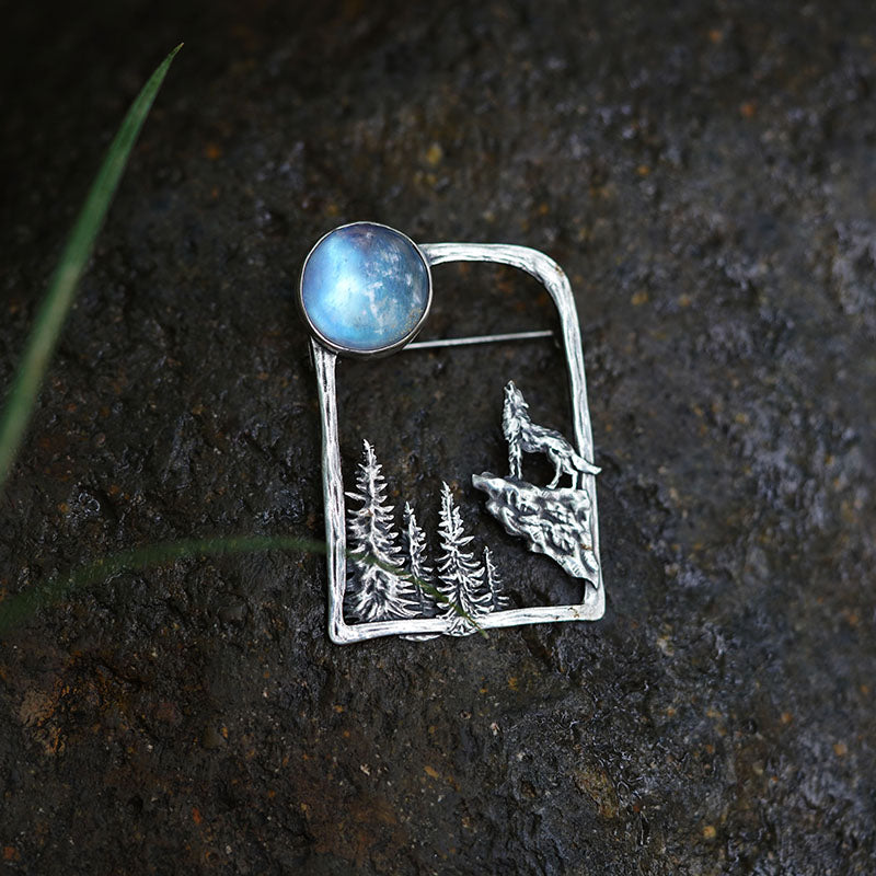 silver brooch with moonstone and wolf