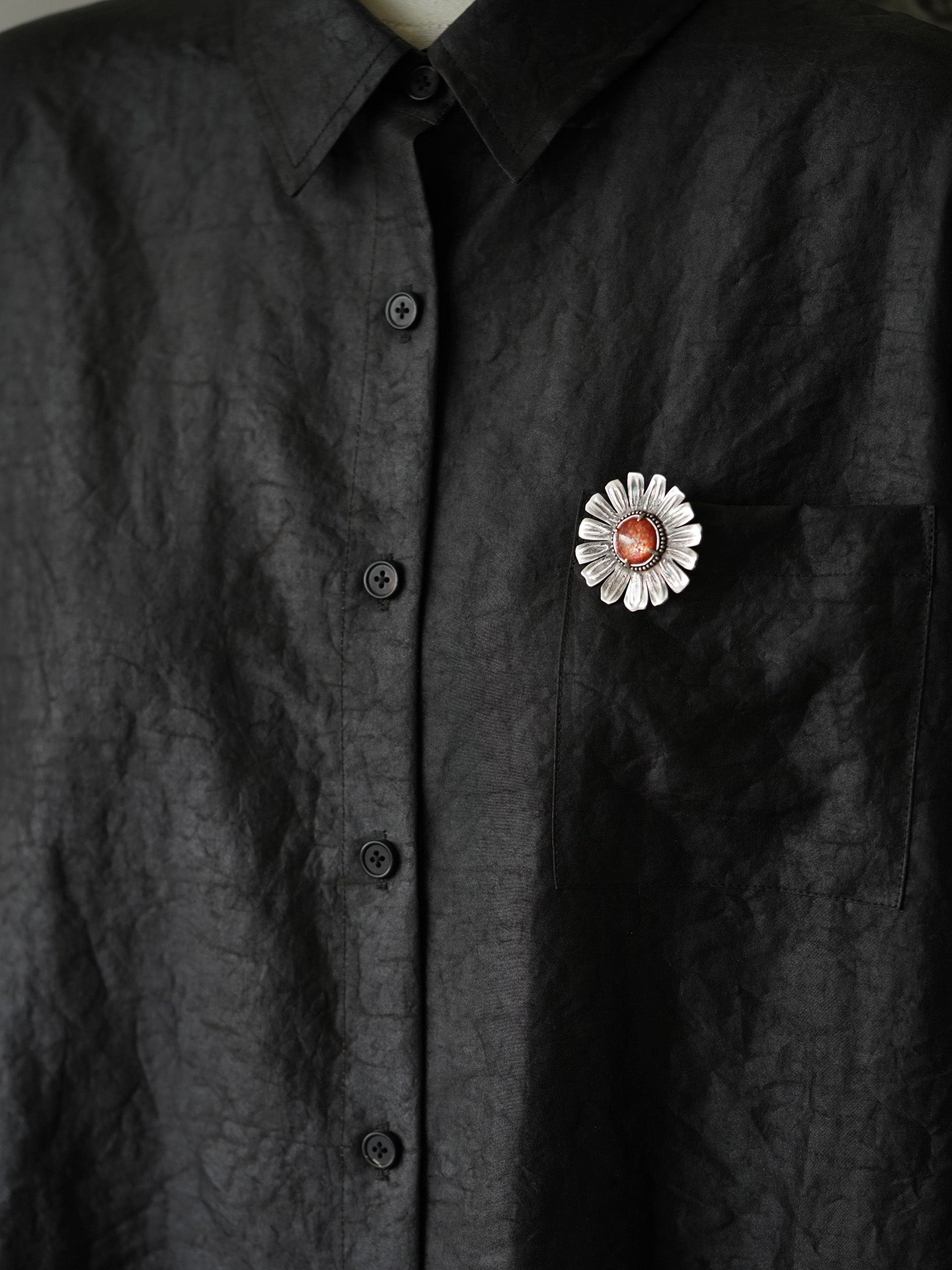 silver brooch with natural sunstone